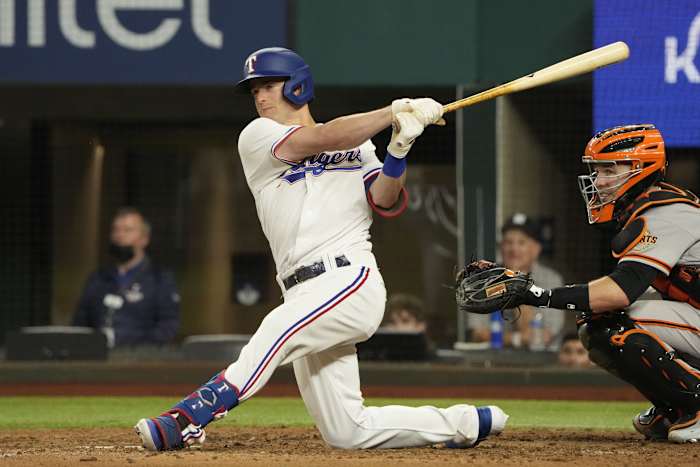 Jun 8, 2021; Arlington, Texas, USA; Texas Rangers second baseman Nick Solak (15) follows through on a swing for a two-run double against the San Francisco Giants during the sixth inning at Globe Life Field.